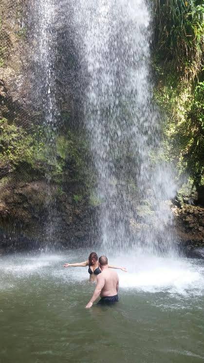 tourists at waterfall in St. Lucia
