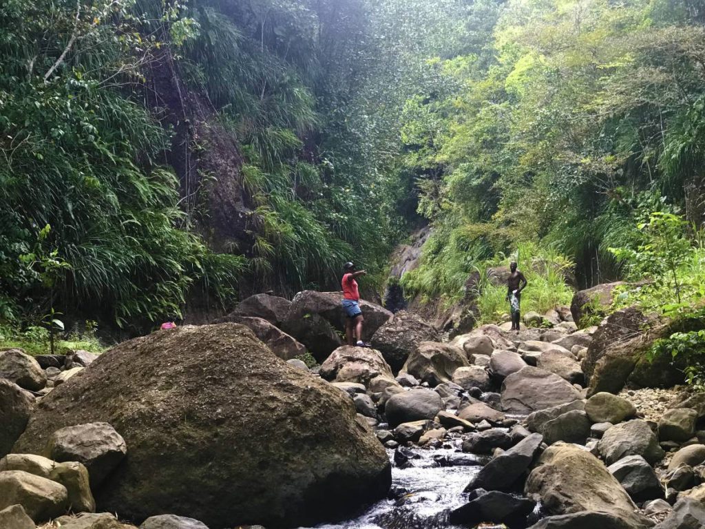 Hikers taking a short break on their way to the waterfall
